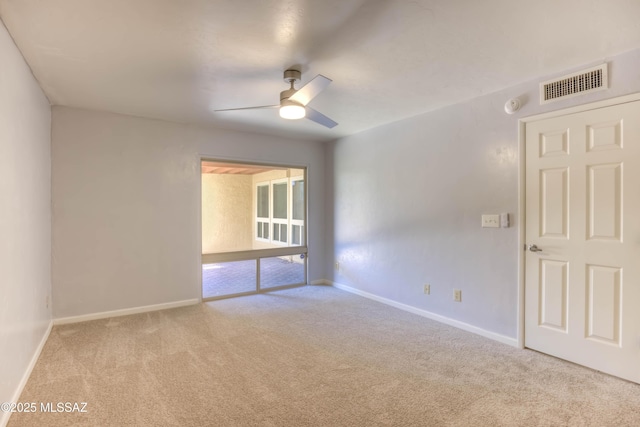 6255 N Camino Pimeria Alta Apt 65, Tucson, AZ 85718 - empty room featuring carpet flooring, a ceiling fan, baseboards, and a smoke detector