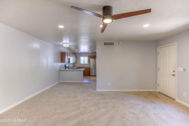 6255 N Camino Pimeria Alta Apt 65, Tucson, AZ 85718 - unfurnished living room with light carpet, recessed lighting, baseboards, and ceiling fan