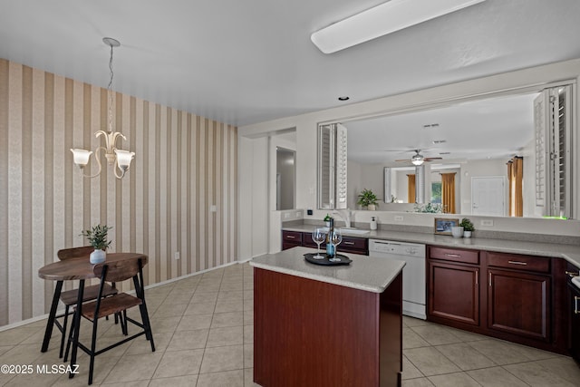1248 W Via Cerro Colorado, Sahuarita, AZ 85629 - kitchen with white dishwasher, light tile patterned floors, light countertops, and a center island