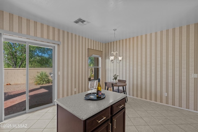 1248 W Via Cerro Colorado, Sahuarita, AZ 85629 - kitchen with light tile patterned floors, light countertops, hanging light fixtures, and a chandelier