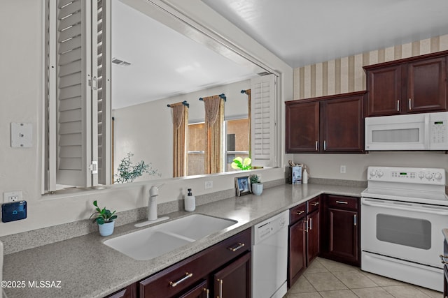 1248 W Via Cerro Colorado, Sahuarita, AZ 85629 - kitchen with white appliances, a sink, and light tile patterned flooring