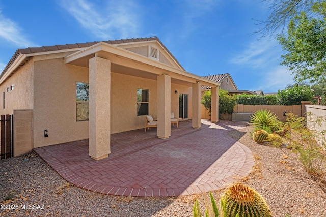 1248 W Via Cerro Colorado, Sahuarita, AZ 85629 - rear view of house with stucco siding and a patio area