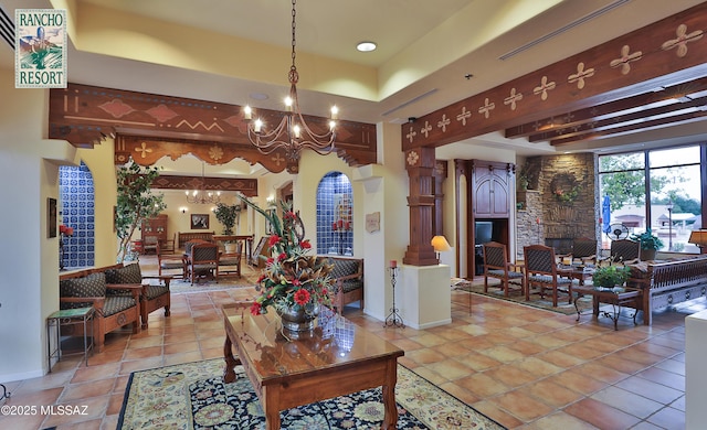 1248 W Via Cerro Colorado, Sahuarita, AZ 85629 - living room featuring a chandelier, baseboards, and a tray ceiling