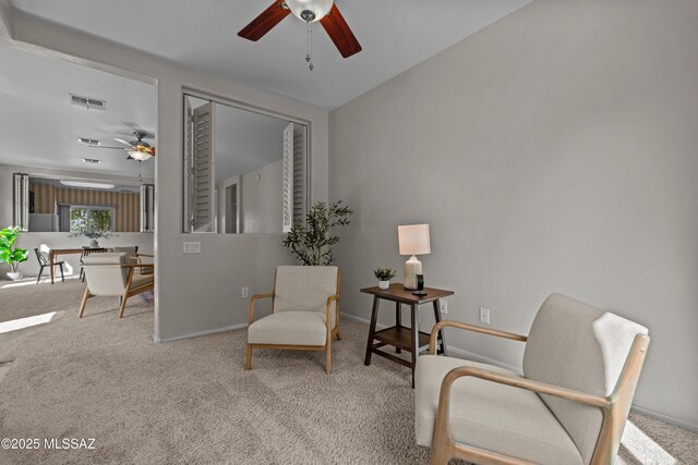 1248 W Via Cerro Colorado, Sahuarita, AZ 85629 - sitting room featuring a ceiling fan, carpet, and baseboards