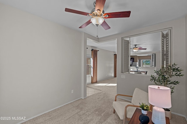 1248 W Via Cerro Colorado, Sahuarita, AZ 85629 - living area featuring carpet floors, a ceiling fan, and baseboards