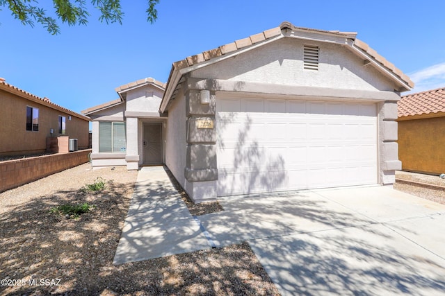 Tucson, AZ 85748 - view of front of home with a tile roof, stucco siding, a garage, concrete driveway, and cooling unit
