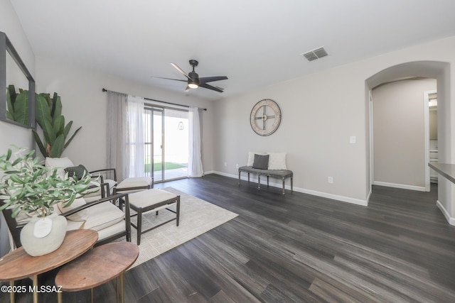 Tucson, AZ 85748 - living room with arched walkways, ceiling fan, dark wood finished floors, and baseboards