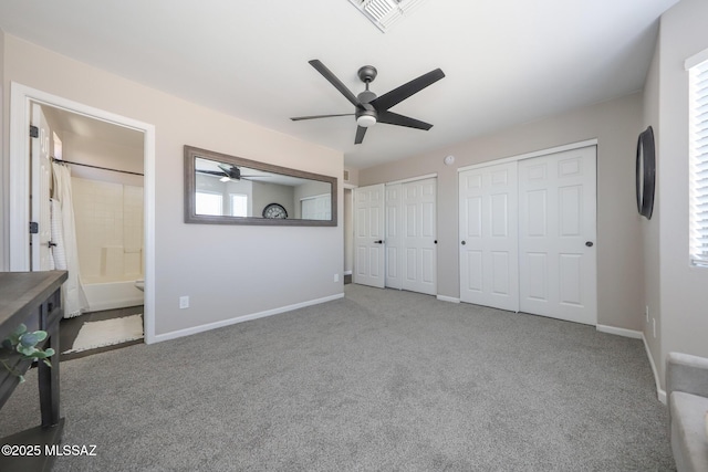 Tucson, AZ 85748 - unfurnished bedroom featuring two closets, carpet flooring, and multiple windows