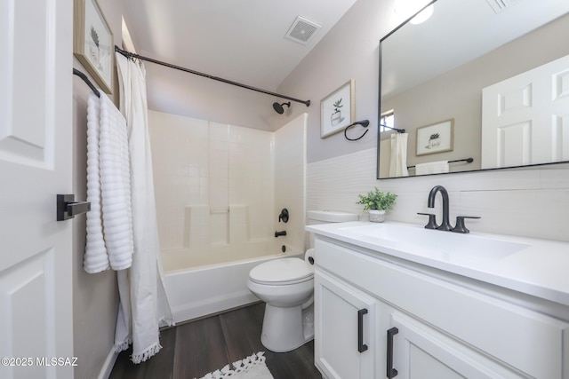 Tucson, AZ 85748 - bathroom with vanity, shower / bathtub combination with curtain, wood finished floors, and toilet