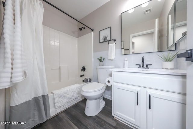 Tucson, AZ 85748 - full bath featuring shower / bathtub combination with curtain, wood finished floors, vanity, toilet, and tasteful backsplash