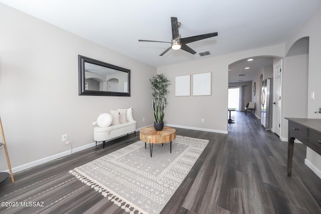 Tucson, AZ 85748 - sitting room with arched walkways, wood finished floors, a ceiling fan, and baseboards