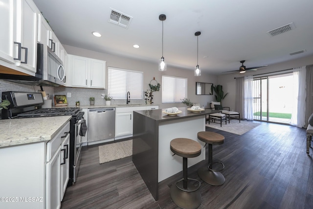 Tucson, AZ 85748 - kitchen with appliances with stainless steel finishes, a sink, healthy amount of natural light, white cabinets, and recessed lighting