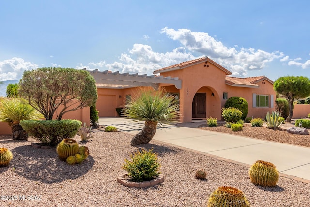 13066 Eagleview Dr, Oro Valley, AZ 85755 - view of front of house featuring driveway, a garage, stucco siding, and a tiled roof