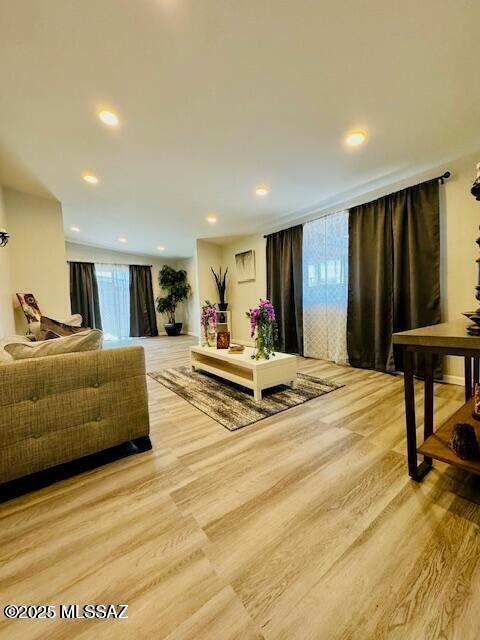 7122 E Eastland St, Tucson, AZ 85710 - living area with light wood finished floors, healthy amount of natural light, and recessed lighting