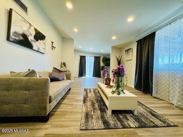 7122 E Eastland St, Tucson, AZ 85710 - living area with light wood-style flooring and recessed lighting
