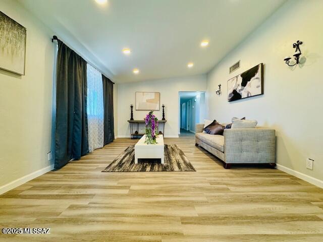 7122 E Eastland St, Tucson, AZ 85710 - living room featuring recessed lighting, light wood-style flooring, and baseboards