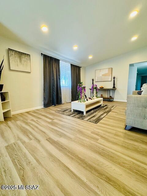 7122 E Eastland St, Tucson, AZ 85710 - living area with wood finished floors, baseboards, and recessed lighting