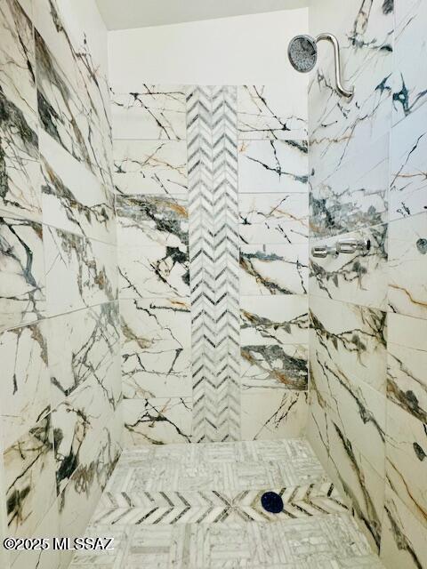 7122 E Eastland St, Tucson, AZ 85710 - detailed view of a marble finish shower