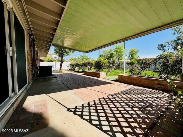 7122 E Eastland St, Tucson, AZ 85710 - view of patio / terrace featuring central AC unit