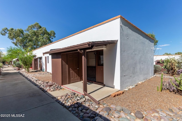 134 S Paseo Quinta Unit A, Green Valley, AZ 85614 - rear view of house featuring stucco siding