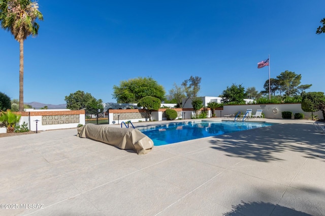 134 S Paseo Quinta Unit A, Green Valley, AZ 85614 - view of pool featuring a mountain view and a patio area