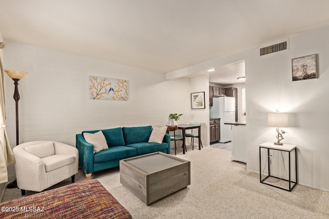 134 S Paseo Quinta Unit A, Green Valley, AZ 85614 - living area featuring baseboards and light colored carpet