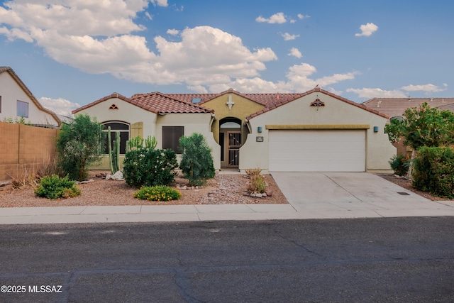 7663 W Creosote Spring Ct, Tucson, AZ 85743 - mediterranean / spanish home featuring stucco siding, an attached garage, a tiled roof, and concrete driveway