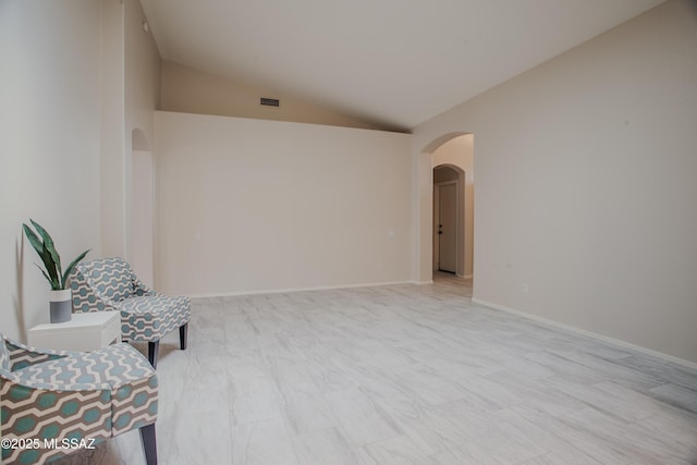 7663 W Creosote Spring Ct, Tucson, AZ 85743 - sitting room with arched walkways and lofted ceiling