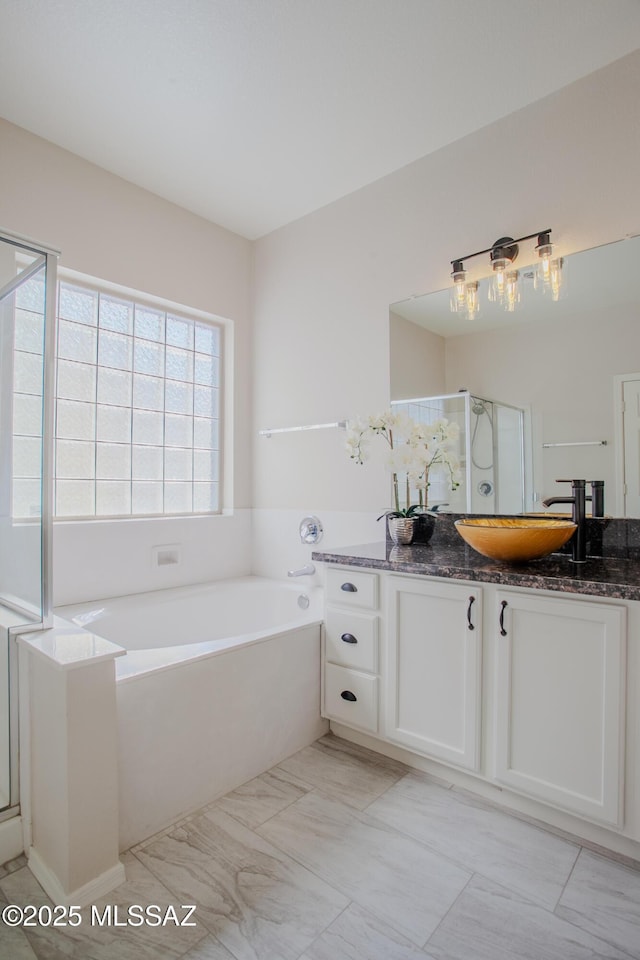 7663 W Creosote Spring Ct, Tucson, AZ 85743 - full bath featuring vanity, a bath, and a shower stall