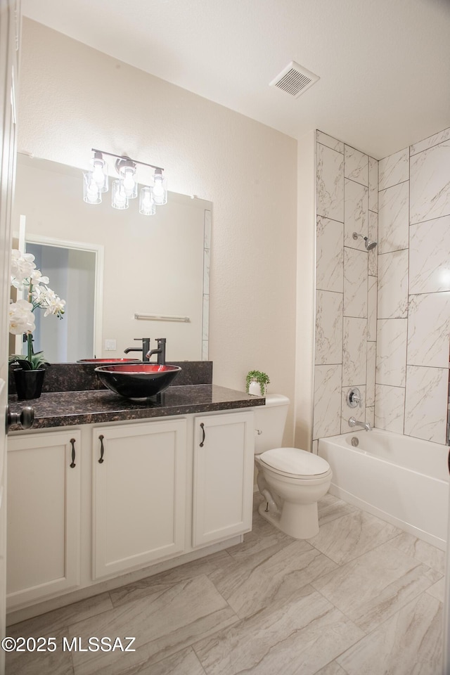 7663 W Creosote Spring Ct, Tucson, AZ 85743 - bathroom with toilet, marble look tiles, vanity, and bathing tub / shower combination