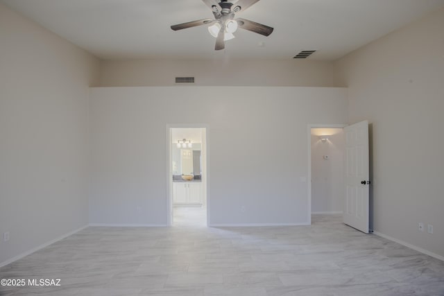 7663 W Creosote Spring Ct, Tucson, AZ 85743 - spare room with a ceiling fan and baseboards