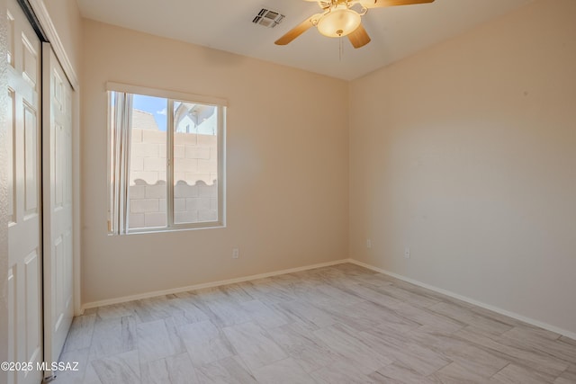 7663 W Creosote Spring Ct, Tucson, AZ 85743 - unfurnished bedroom featuring a closet, baseboards, and a ceiling fan