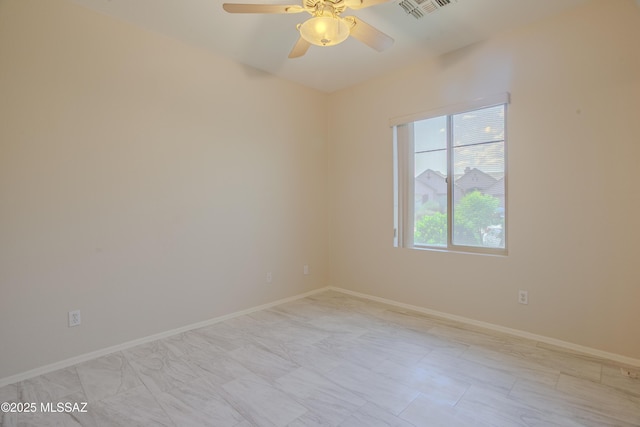 7663 W Creosote Spring Ct, Tucson, AZ 85743 - unfurnished room featuring a ceiling fan and baseboards