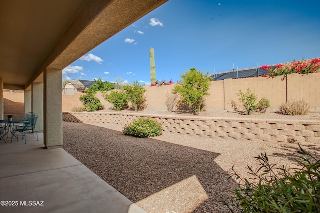 7663 W Creosote Spring Ct, Tucson, AZ 85743 - fenced backyard with a patio and outdoor dining area