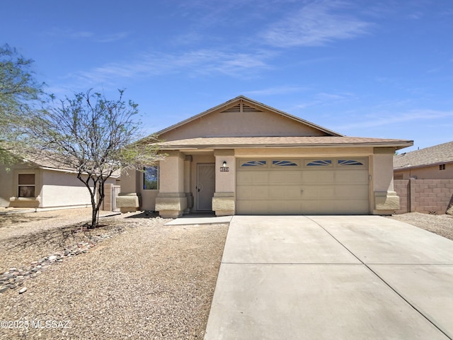 8233 E Sundew Dr, Tucson, AZ 85710 - ranch-style home featuring stucco siding, driveway, and an attached garage