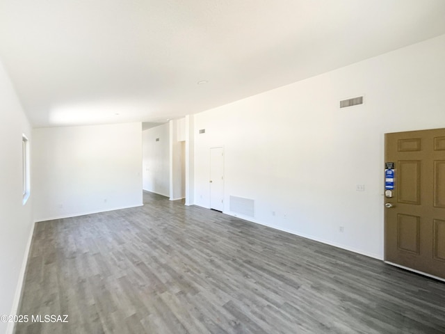 8233 E Sundew Dr, Tucson, AZ 85710 - spare room featuring wood finished floors and baseboards
