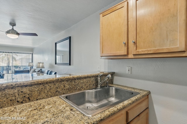 961 N Euclid Ave Unit 130, Tucson, AZ 85719 - kitchen featuring a sink, a ceiling fan, light brown cabinetry, and open floor plan