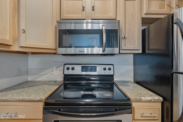961 N Euclid Ave Unit 130, Tucson, AZ 85719 - kitchen with stainless steel appliances, tasteful backsplash, light brown cabinets, and light stone countertops