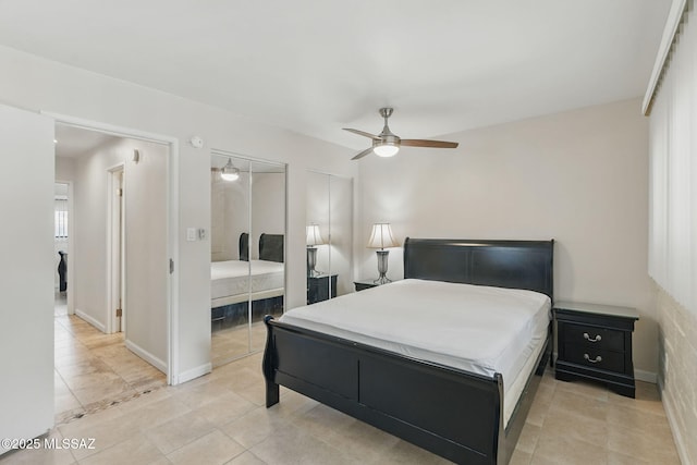 961 N Euclid Ave Unit 130, Tucson, AZ 85719 - bedroom with light tile patterned floors, a ceiling fan, and multiple closets