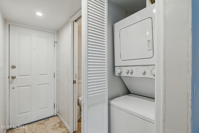 961 N Euclid Ave Unit 130, Tucson, AZ 85719 - laundry area with stacked washer / drying machine and light tile patterned floors