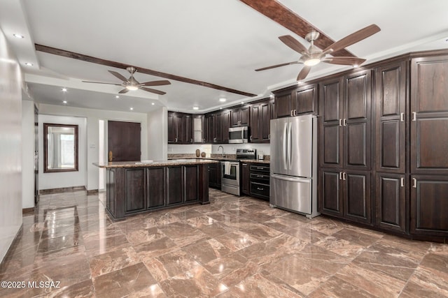 3940 E Timrod St Unit 118, Tucson, AZ 85711 - kitchen with appliances with stainless steel finishes, a ceiling fan, recessed lighting, dark brown cabinetry, and a center island