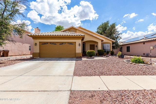 7157 W Odyssey Way, Tucson, AZ 85743 - mediterranean / spanish-style house featuring stucco siding, a chimney, an attached garage, and concrete driveway