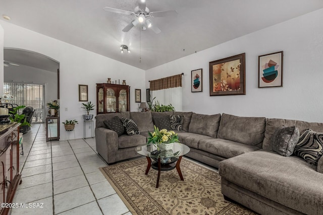 7157 W Odyssey Way, Tucson, AZ 85743 - living area featuring ceiling fan, lofted ceiling, light tile patterned floors, and arched walkways