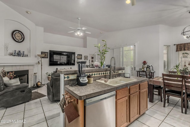 7157 W Odyssey Way, Tucson, AZ 85743 - kitchen featuring a sink, stainless steel dishwasher, light tile patterned floors, vaulted ceiling, and ceiling fan