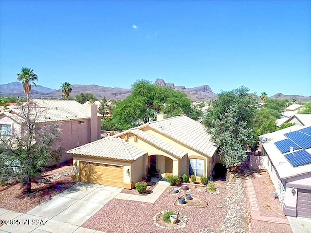 7157 W Odyssey Way, Tucson, AZ 85743 - view of front of property with a tiled roof, a garage, a mountain view, driveway, and stucco siding