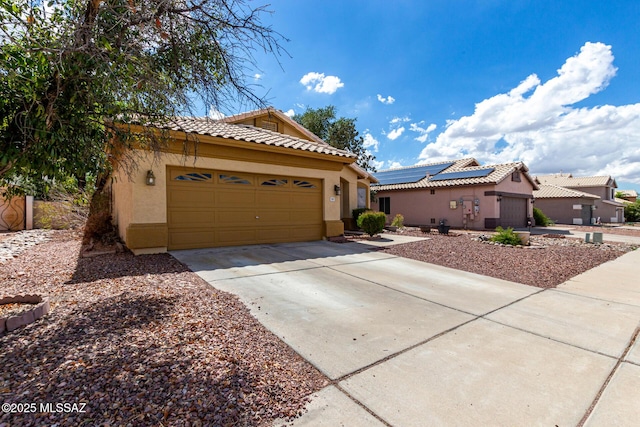 7157 W Odyssey Way, Tucson, AZ 85743 - view of front of house featuring stucco siding, a garage, driveway, and a tiled roof