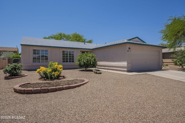 8954 E Pomegranate St, Tucson, AZ 85730 - ranch-style home with an attached garage, concrete driveway, and stucco siding