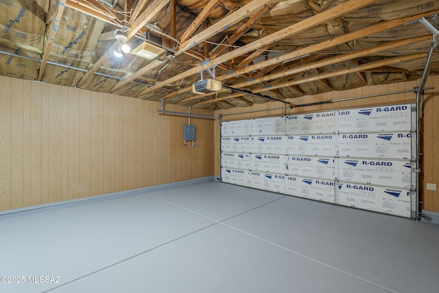 8954 E Pomegranate St, Tucson, AZ 85730 - garage with wooden walls and a garage door opener