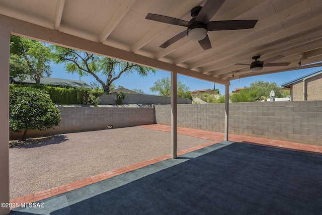 8954 E Pomegranate St, Tucson, AZ 85730 - fenced backyard with ceiling fan and a patio area