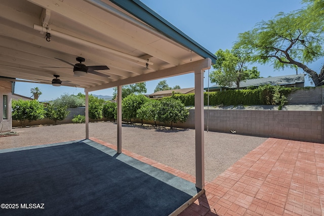 8954 E Pomegranate St, Tucson, AZ 85730 - fenced backyard with a ceiling fan and a patio